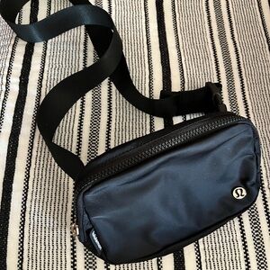 NWOT, Lululemon, Authentic, Everywhere Bag.  Black, larger size, Adj strap